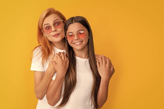 hugging kid and mom. mother and daughter in sunglasses. beauty and fashion. female fashion model. young girls in eyeglasses. portrait of happy child and mom. express positive emotions. friendship.