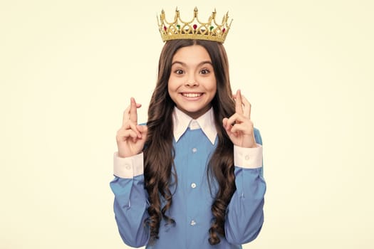 Teenager princess child celebrates success win and victory. Teen girl in queen crown isolated on white background