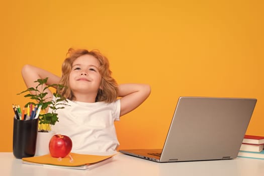 School child using laptop computer. School kid student learning, study language or literature at school. Elementary school child. Portrait of nerd pupil studying