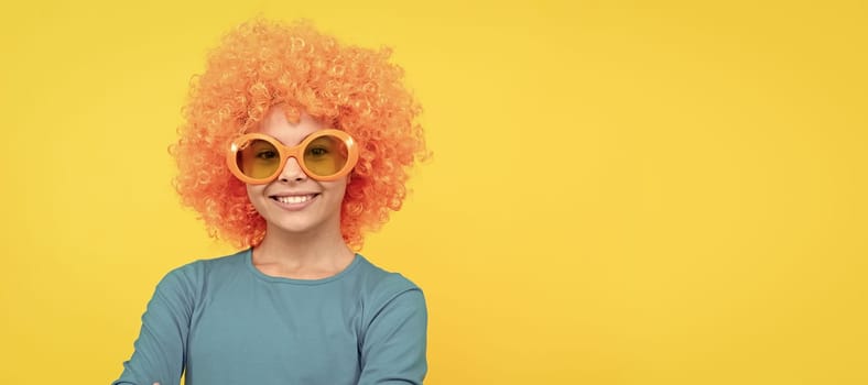 pleasant smile. happy childhood. girls birthday party. happy funny kid in curly wig. time for fun. Funny teenager child in wig, party poster. Banner header, copy space