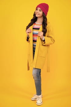 Full length of her she attractive pretty lovely cute cheerful cheery teenager child girl isolated over vivid yellow background. Happy teenager, positive and smiling emotions of teen girl
