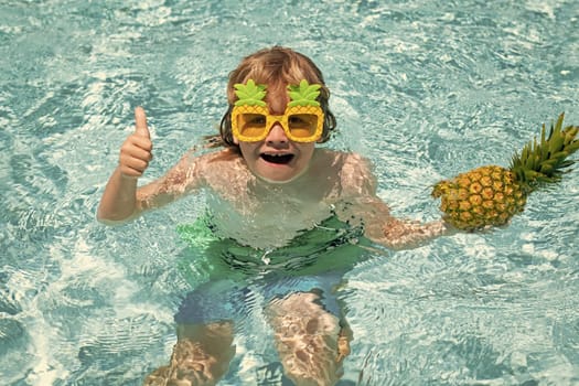Child in swimming pool. Summer kids activity. Summer vacation. Healthy kids lifestyle