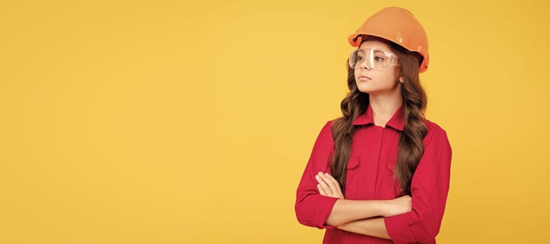Renovation child, serious teenager girl in protective eyeglasses and helmet, copy space, building. Child builder in helmet horizontal poster design. Banner header, copy space