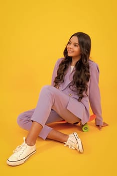 Full length of her she attractive pretty lovely cute cheerful cheery teenager child girl isolated over vivid yellow background