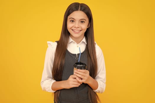 School girl with take away cup of cappuccino coffee or tea. Child with plastic takeaway mug, morning drink cocoa beverage