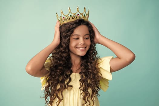 Teenager princess child celebrates success win and victory. Teen girl in queen crown. Happy teenager, positive and smiling emotions of teen girl