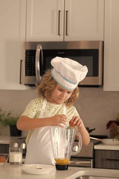 Chef kid cook baking at home kitchen. Kid chef cook cookery at kitchen. Cooking, culinary and kids. Little boy in chefs hat and apron
