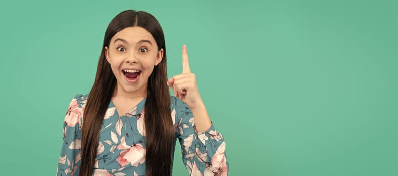 Aha. Happy kid got idea blue background. Eureka moment. Girl genius point finger up. Eureka. Child face, horizontal poster, teenager girl isolated portrait, banner with copy space