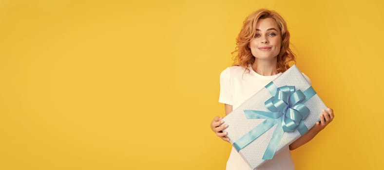 smiling redhead lady with giftbox. mothers day. Beauty woman isolated face portrait, banner with mock up copy space