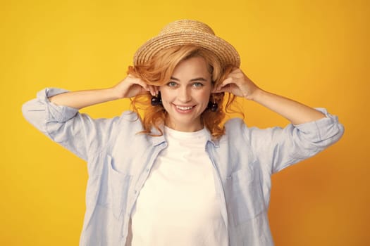 Cherry earrings. Womans enjoying a fresh sweet cherry. Female eating cherries on yellow background