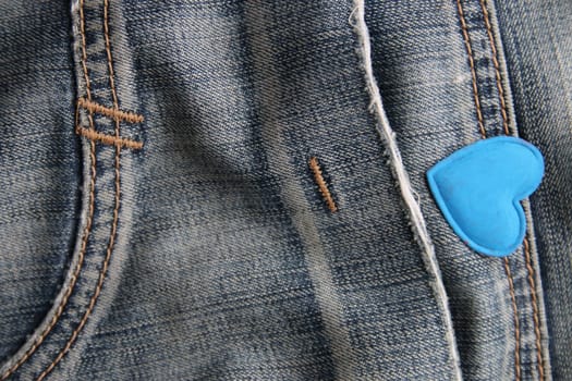 Blue heart on jeans. Creative Birthday background.