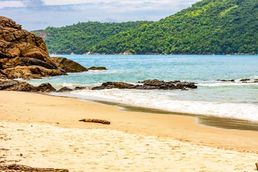 The sea between the beach, rocks and fully preserved rainforest in Trindade, Paraty district in Rio de Janeiro