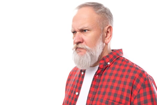 sullen 60s retired man with white beard and mustache in red shirt.