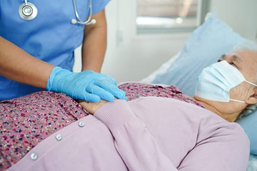 Doctor holding hands Asian elderly woman patient, help and care in hospital.