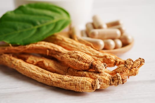 Ginseng roots and green leaf, healthy food.