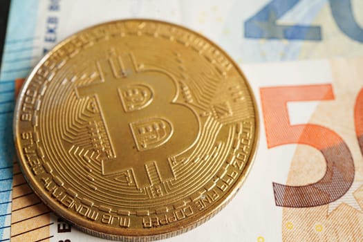 Golden bitcoin on Euro banknotes money for business and commercial, Digital currency, Virtual cryptocurrency.