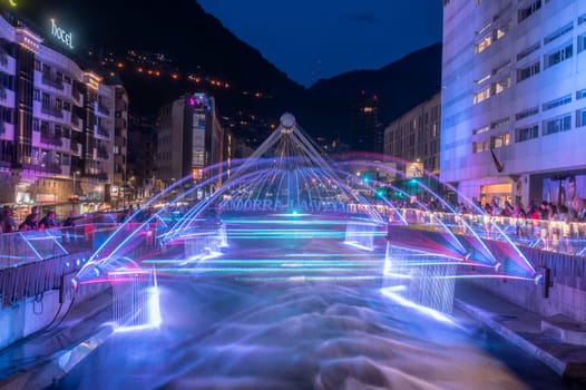 Andorra La Vella, Andorra : 2023 July 7 : Light and water show in the Capital of Andorra on the Valira River in Andorra La Vella in 2023.