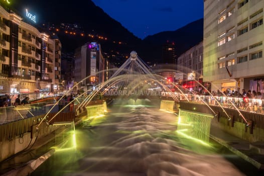 Andorra La Vella, Andorra : 2023 July 7 : Light and water show in the Capital of Andorra on the Valira River in Andorra La Vella in 2023.