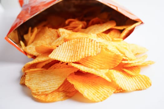 Potato chips in open bag, delicious BBQ seasoning spicy for crips, thin slice deep fried snack fast food.