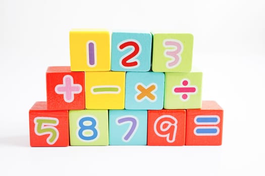 Number wood block cubes for learning Mathematic, education math concept.