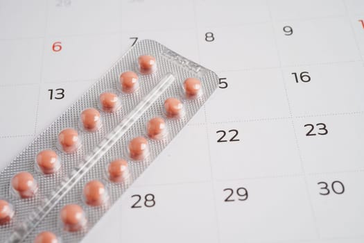 Birth control pills for female on calendar, ovulation day.