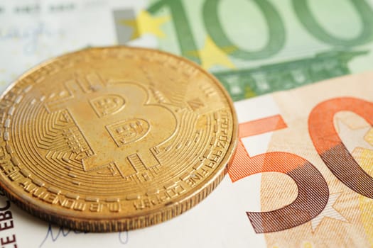 Golden bitcoin on Euro banknotes money for business and commercial, Digital currency, Virtual cryptocurrency.