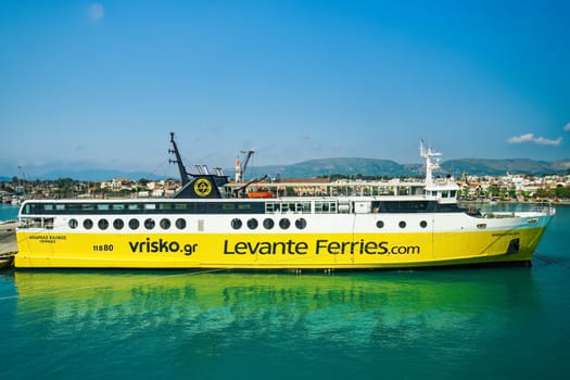 Andreas Kalvos Levante Ferries car passenger boat with distinctive colors and logo moored on a calm sea port in the Ionian Islands.