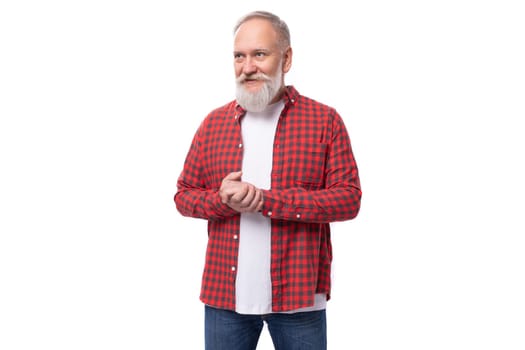 handsome 60s elderly man with gray beard in casual shirt.