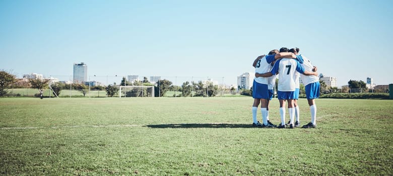 Sports, mockup and a team of soccer players in a huddle on a field for motivation before a game. Football, fitness and training with man friends getting ready for competition on a pitch together.