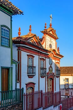 Baroque church facade and colonial houses in the city of Diamantina in Minas Gerais