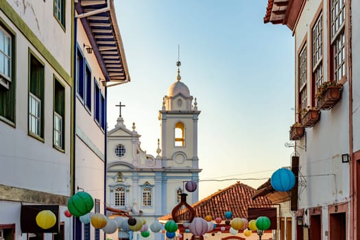 Houses and church in the streets of the city of Diamantina decorated with colorful lanterns and light fixtures
