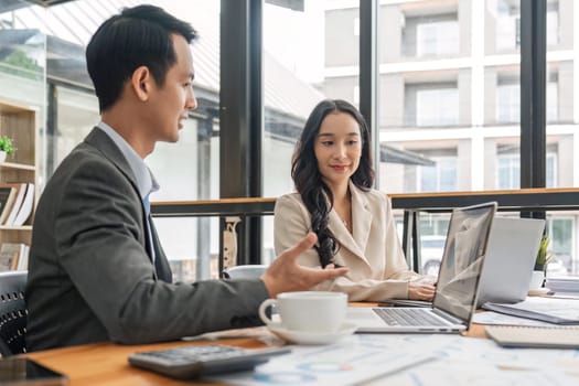 Teamwork meeting, laptop and business people in office workplace. Collaboration, technology and workers, business or employees with screen planning sales, research or financial strategy in company.