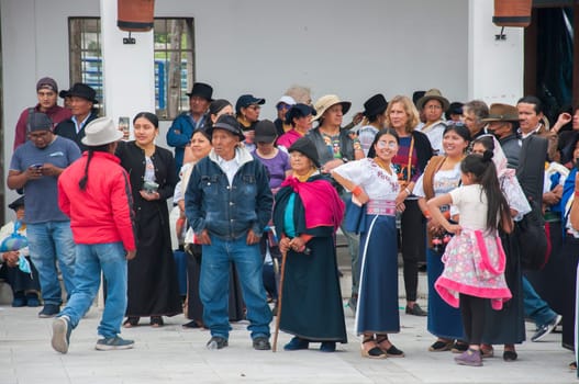 Otavalo, Ecuador - 24 de junio de 2023: men, women, children and the elderly attending inti raymi in ecuador. High quality photo