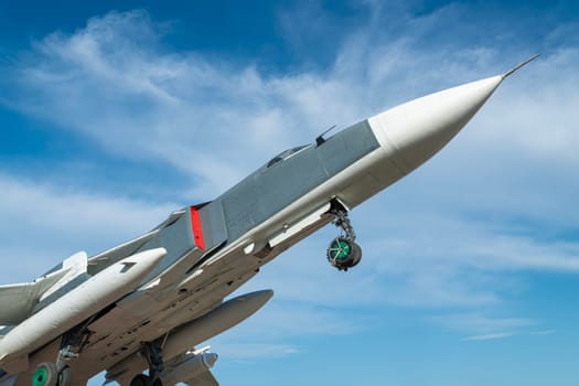 combat aircraft fighter bomber on a blue sky background. photo