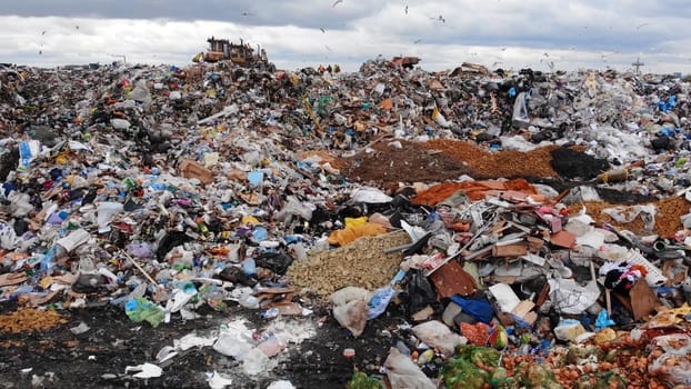 Large landfill near the metropolis in autumn