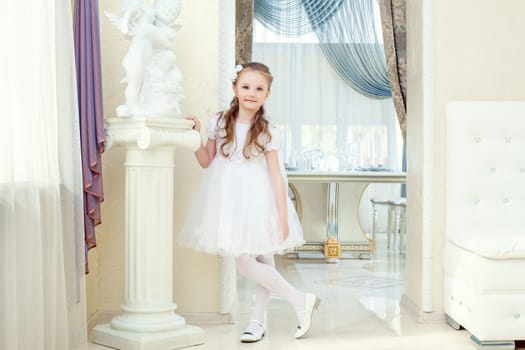 Image of adorable little girl posing in elegant dress