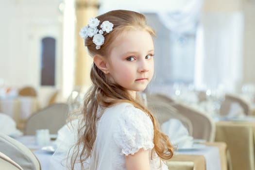 Portrait of cute little girl posing with hair decoration