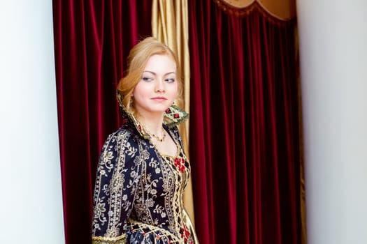 Image of beautiful young actress smiles wistfully at camera