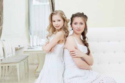 Portrait of lovely young models posing in restaurant