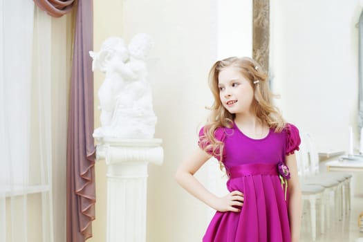 Image of merry blonde model posing in magenta dress