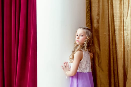 Image of cute blond little girl posing looking at camera
