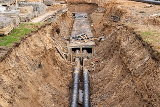 Pipes for heating water in the ground close up