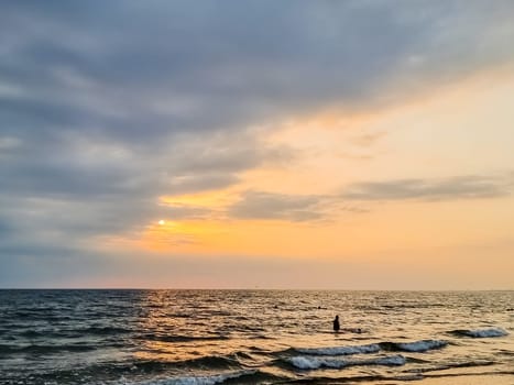 sunset at coast of the lake. Nature landscape. Nature in northern Europe. reflection, blue sky and yellow sunlight. landscape during sunset.