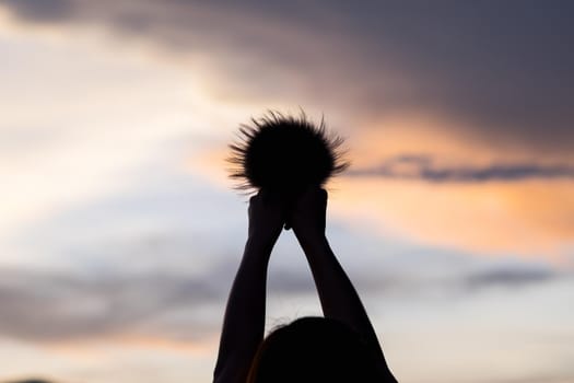 hand girl on sunset background