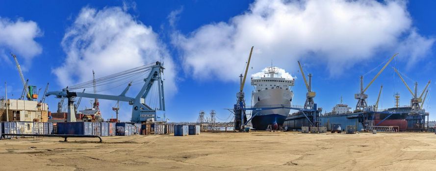 Chernomorsk, Ukraine. 21.03.2021. Large ship in dry dock of the Chernomorsk Shipyard on a sunny spring day