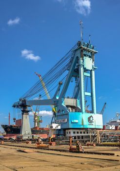 Chernomorsk, Ukraine. 21.03.2021. Large shipyard crane in the Chernomorsk Shipyard on a sunny spring day