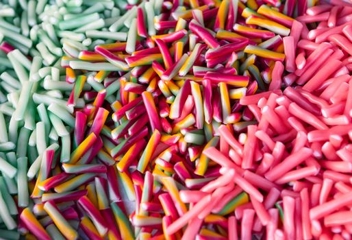 Assorted mix of chewing sweets. Multicolored abstract background. Beautiful color mixing texture. Sweets concept.