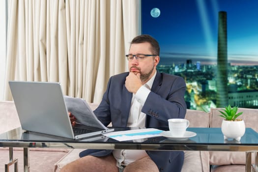 Man in suit without pants working online. home office, video conference, self-isolation concept. Businessman working at home. Remote work, work on the Internet, remotely