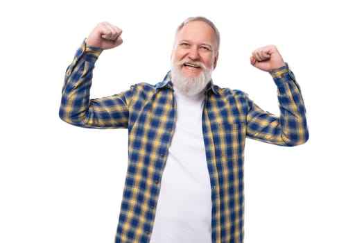 healthy strong senior pensioner gray-haired man with a beard in a shirt on a white background.