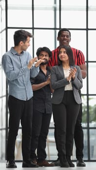 successful business team communicate in office corridor